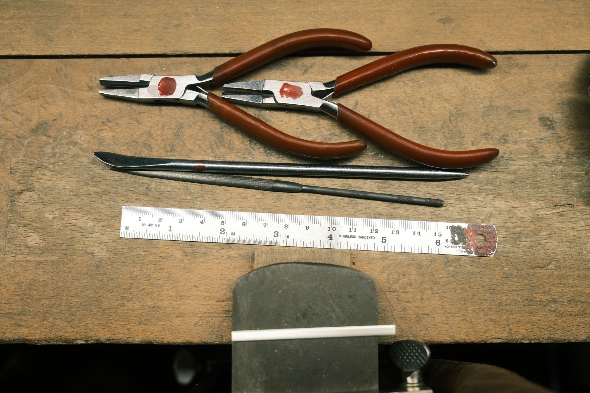 Jewellery hand tools laid out on a workbench